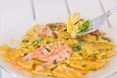 Farfalle pasta with shirimps, saffron and lemon zest.