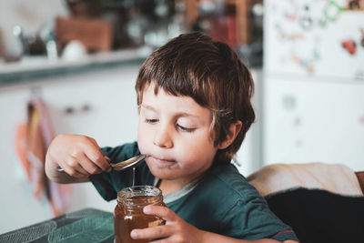 Close-up portrait of boy holding ice cream