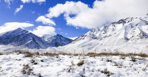 Scenic view of snowcapped mountains against sky