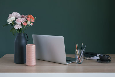 Close-up of flower vase on table