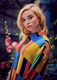 Portrait of beautiful young woman standing outdoors