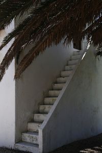 Staircase by wall