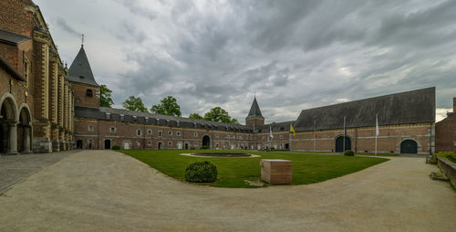 Historic building against cloudy sky