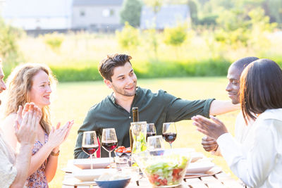 Friends enjoying picnic at park