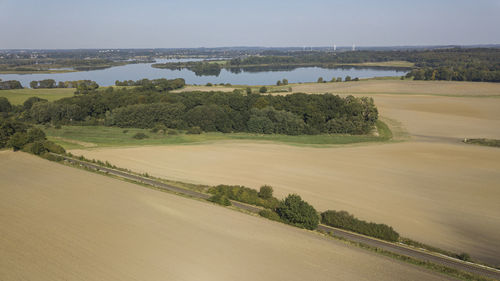 Scenic view of farm against sky