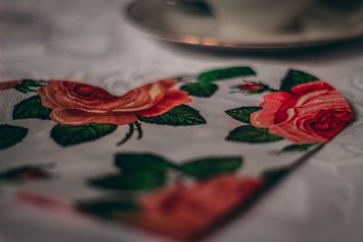 Close-up of multi colored roses on bed