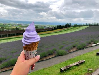 Hand holding ice cream cone