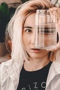 Close-up of young woman drinking glass