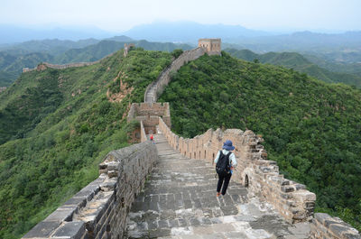 Rear view of woman standing at great wall of china