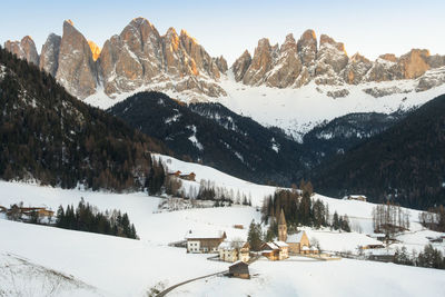 Scenic view of snow covered mountains against sky