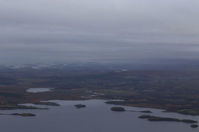 Aerial view of river amidst landscape against sky