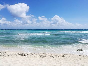 Scenic view of sea against blue sky