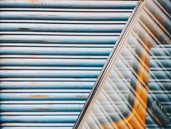 Full frame shot of closed shutter pattern with reflection