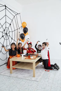 Group of people sitting on table
