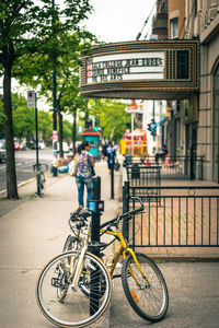 Bicycles parked on sidewalk in city