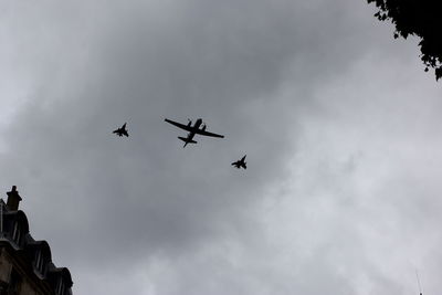 Low angle view of airplane flying in sky