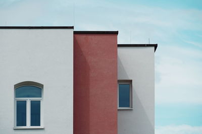 Low angle view of buildings against sky in city