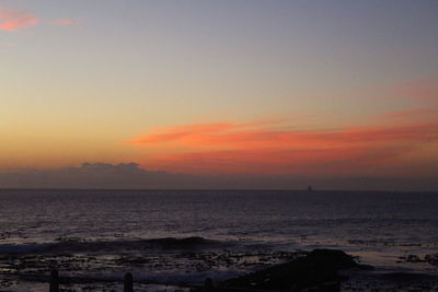 Scenic view of sea against sky at sunset