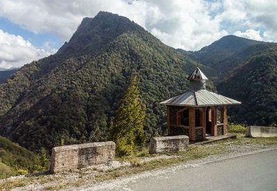 Built structure on mountain against sky