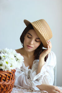 Portrait of a young woman flowers basket