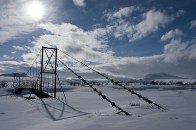 Scenic view of snow covered shore against sky