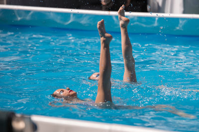 Man swimming in pool