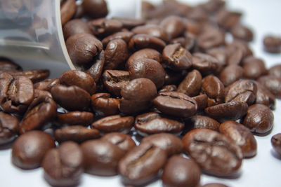 Close-up of coffee beans on table