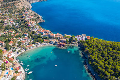 High angle view of sea and buildings in city