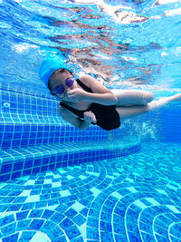 Woman swimming in pool