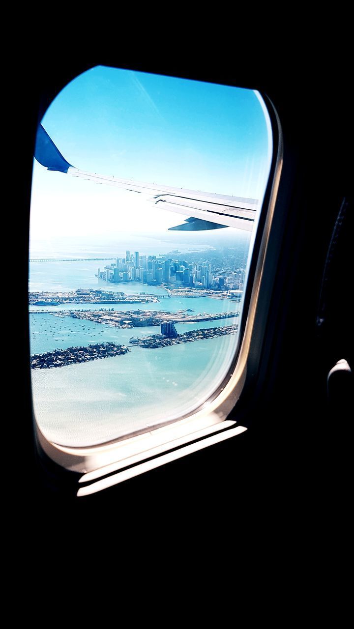 VIEW OF LANDSCAPE SEEN FROM AIRPLANE WINDOW