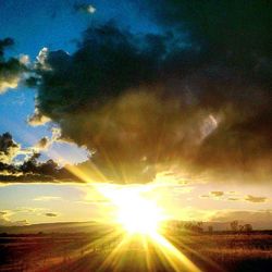 Scenic view of landscape against cloudy sky