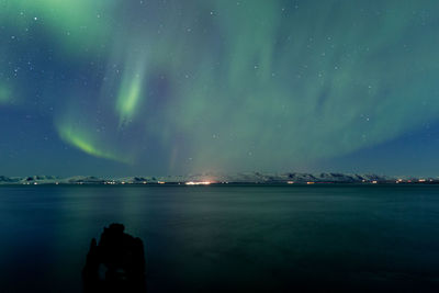 Scenic view of sea against sky at night