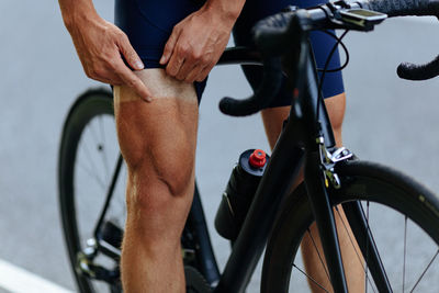 Low section of man riding bicycle
