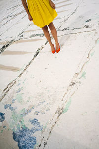 Low section of woman on beach