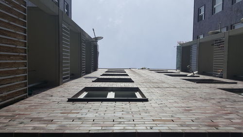 Low angle view of tall building against the sky