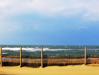 Scenic view of sea against cloudy sky