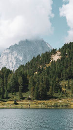 Scenic view of lake and mountains against sky