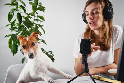 Woman with dog doing podcast