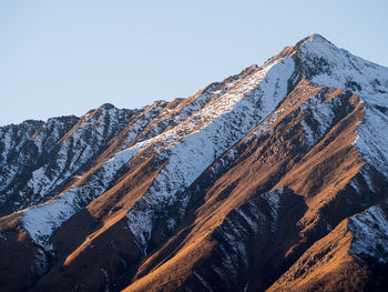 Snowcapped mountains against clear sky