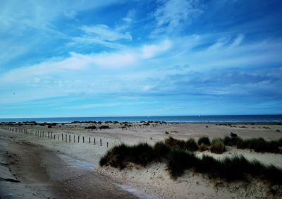 Scenic view of beach against sky