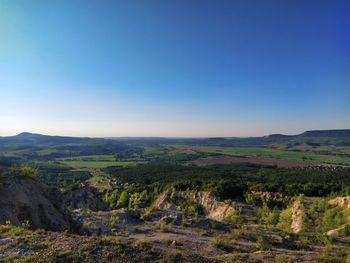 Scenic view of landscape against clear blue sky