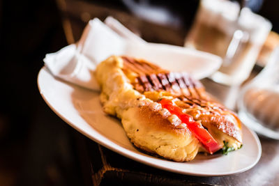 Close-up of sandwich in plate on table at restaurant