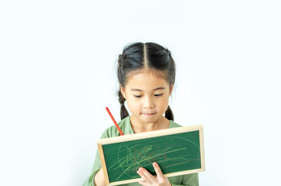 Portrait of a smiling girl over white background