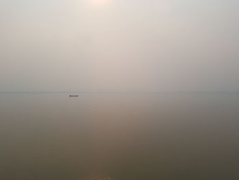 Scenic view of sea against clear sky during sunset