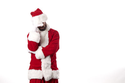 Midsection of man with red umbrella against white background