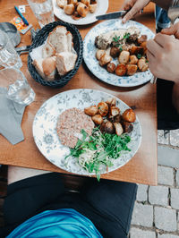 Midsection of man preparing food on table