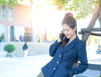 Young woman standing outdoors