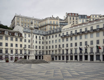 Buildings in city against sky