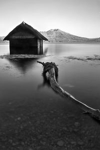 Pier over lake against sky