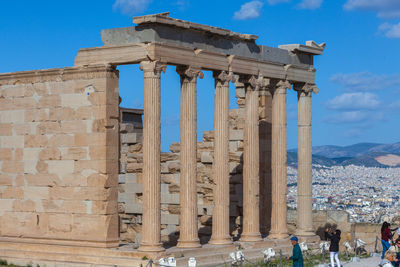 Athens greece - tourists take photos to the erechtheion columns in the acropolis